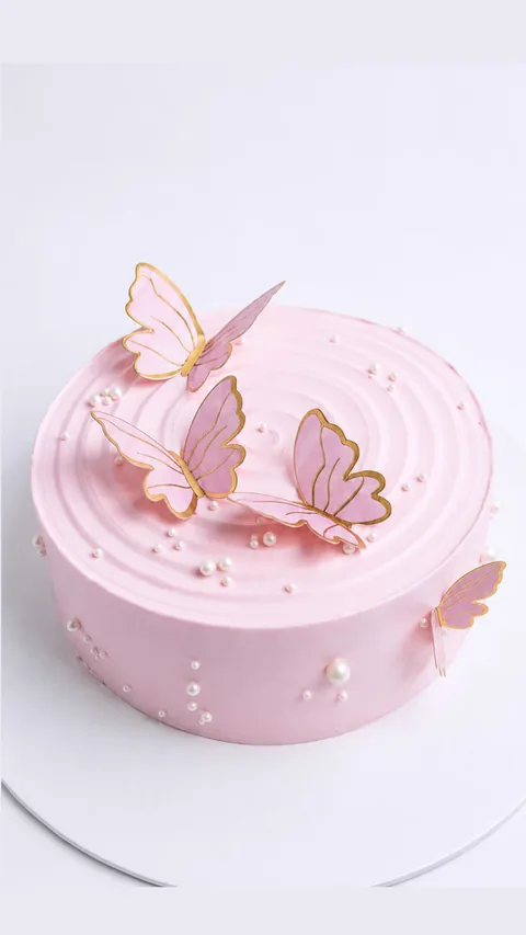 Pink butterflies custom cake by Lueur Patisserie