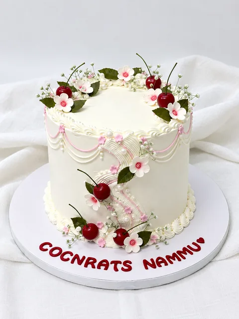 Cherries and blossoms custom cake by Lueur Patisserie