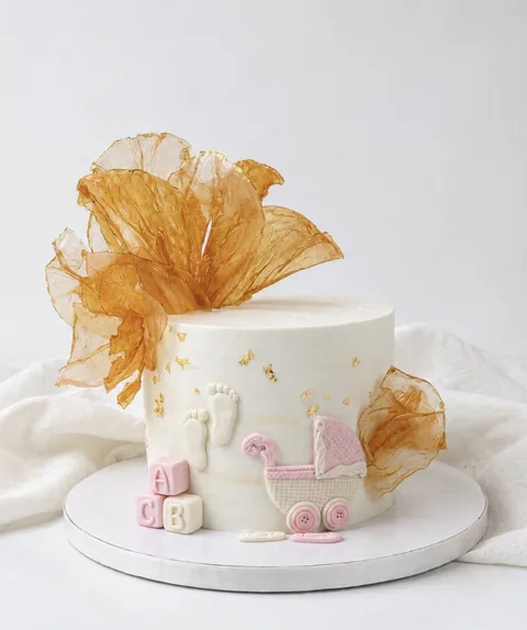 Sculptural gold sails custom cake by Lueur Patisserie