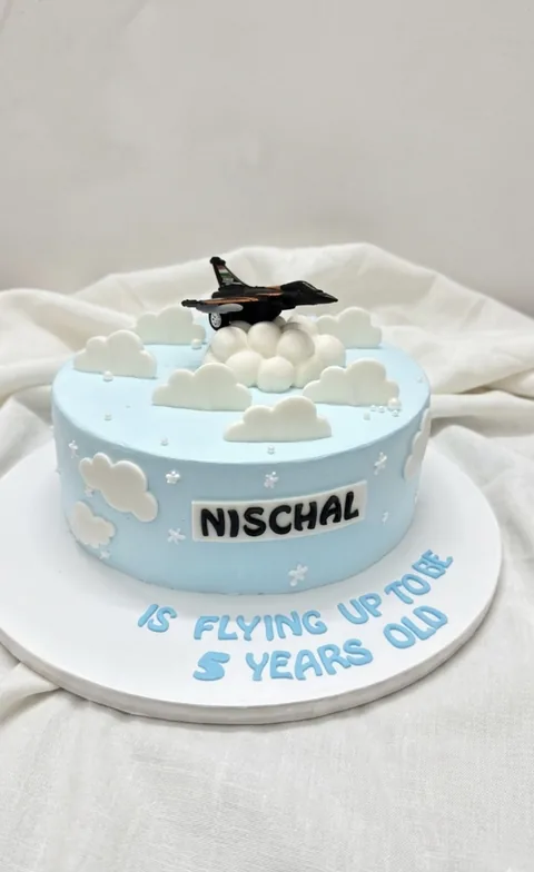 Sky-blue pilot custom cake by Lueur Patisserie