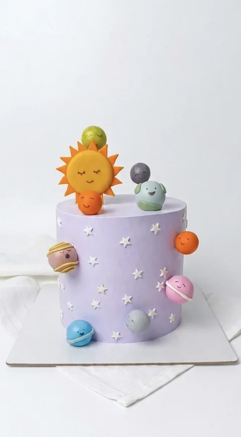 Pastel solar system custom cake by Lueur Patisserie