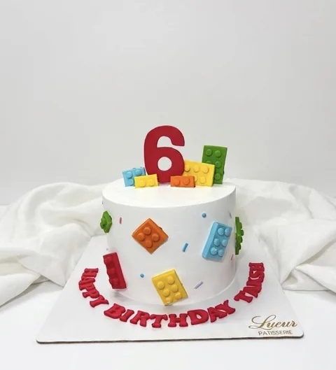Building-block party custom cake by Lueur Patisserie