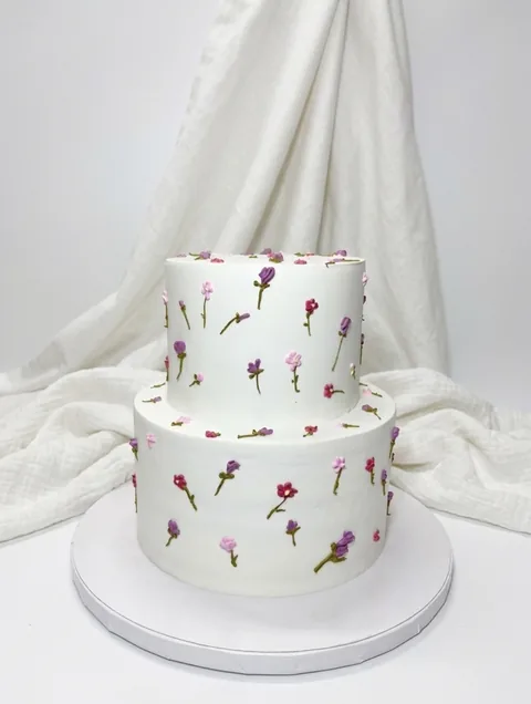 Tiny blossom tiers custom cake by Lueur Patisserie